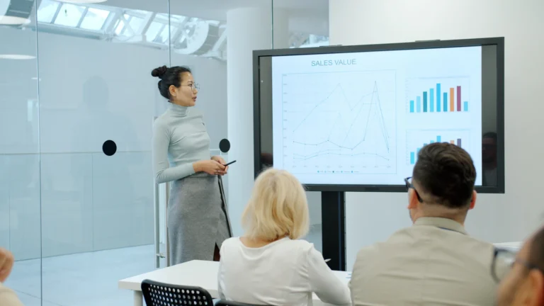 A trainer presenting a chart to a small group