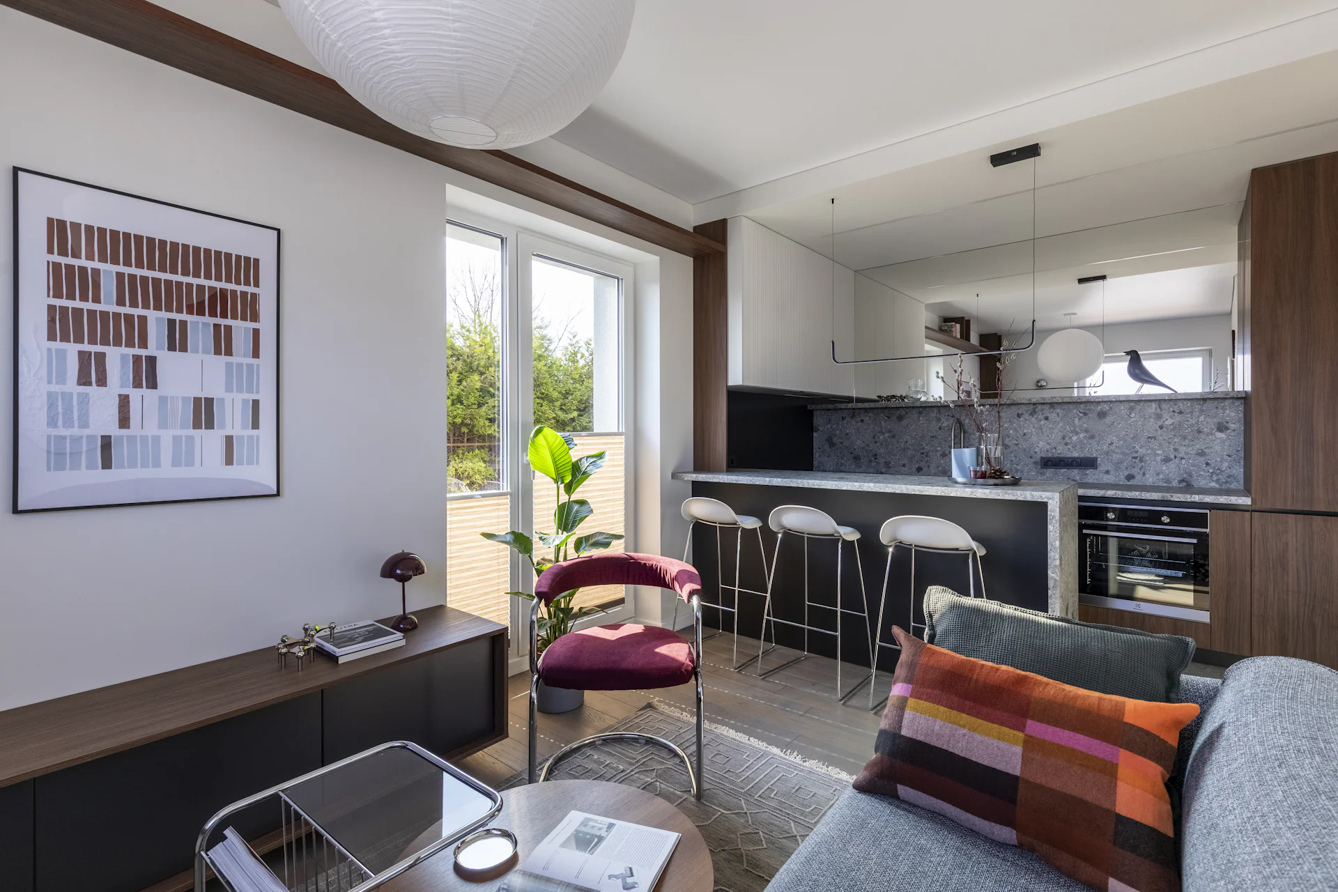 Bright open-plan apartment with kitchen and balcony