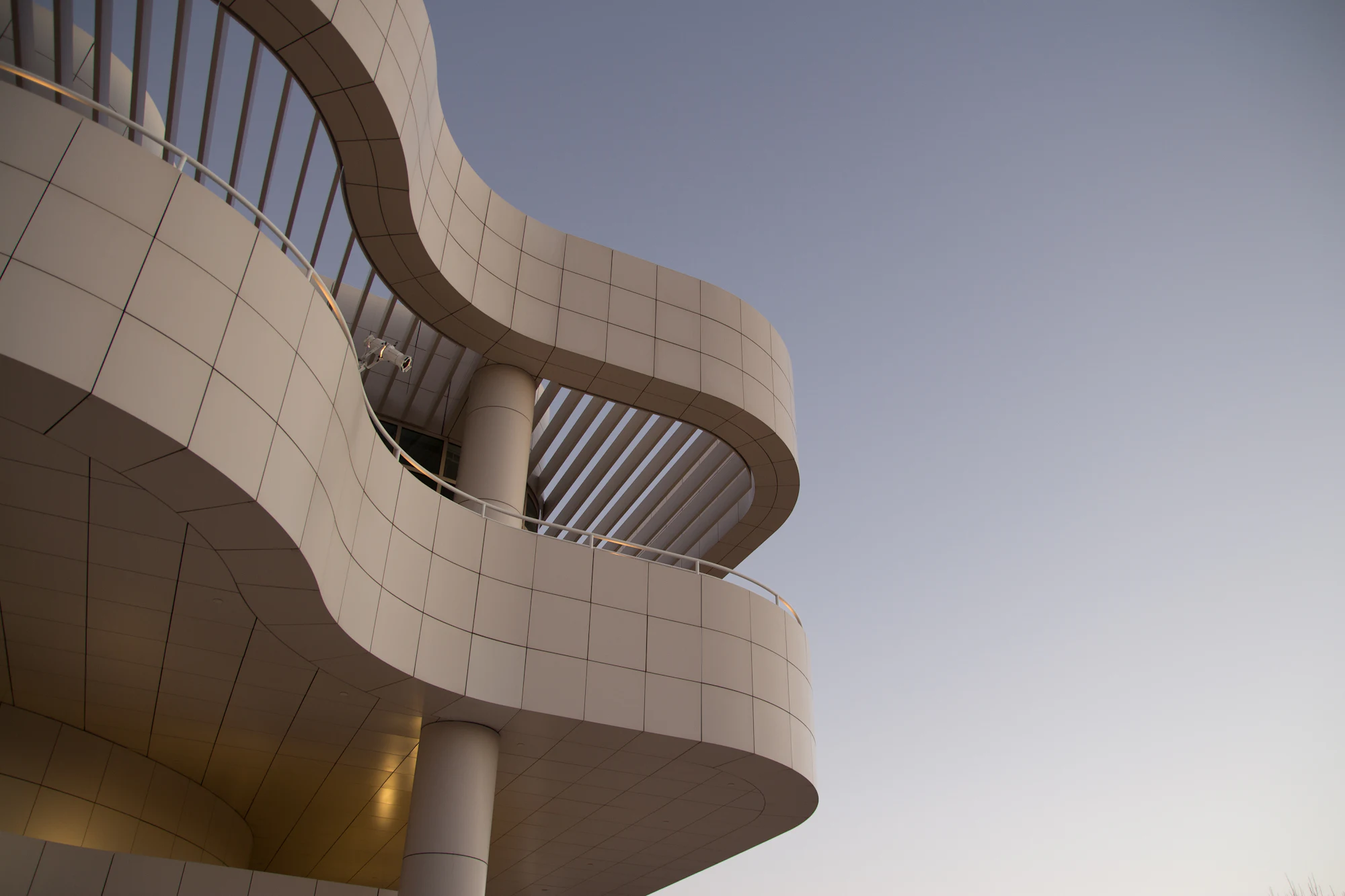 Modern curved building facade against the sky