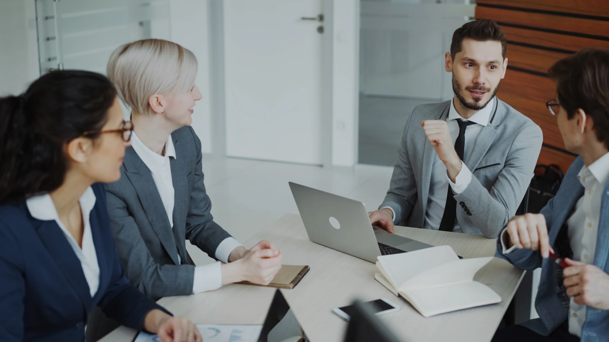 Team of consultants in a meeting around a table