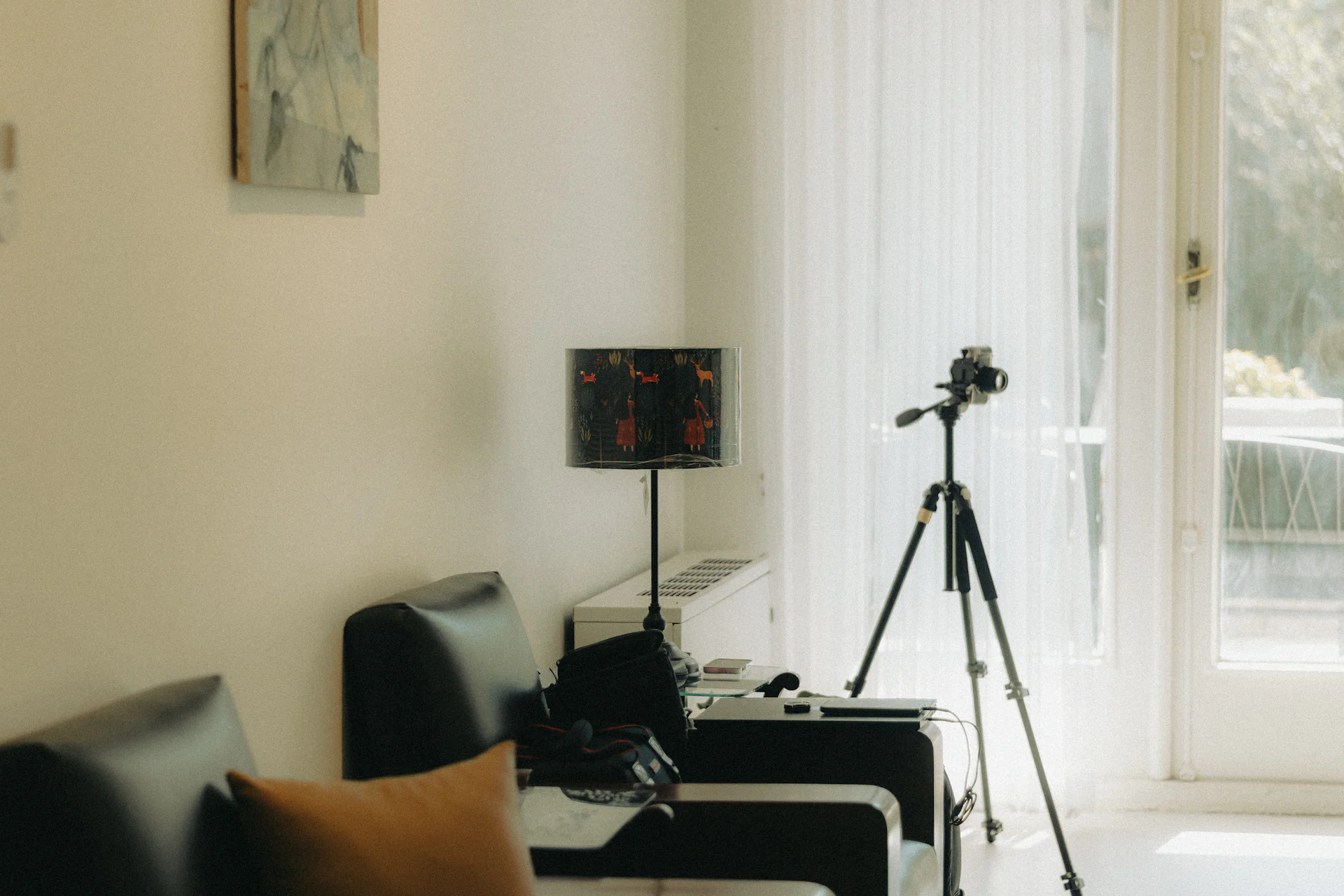 Camera on a tripod in a bright living room