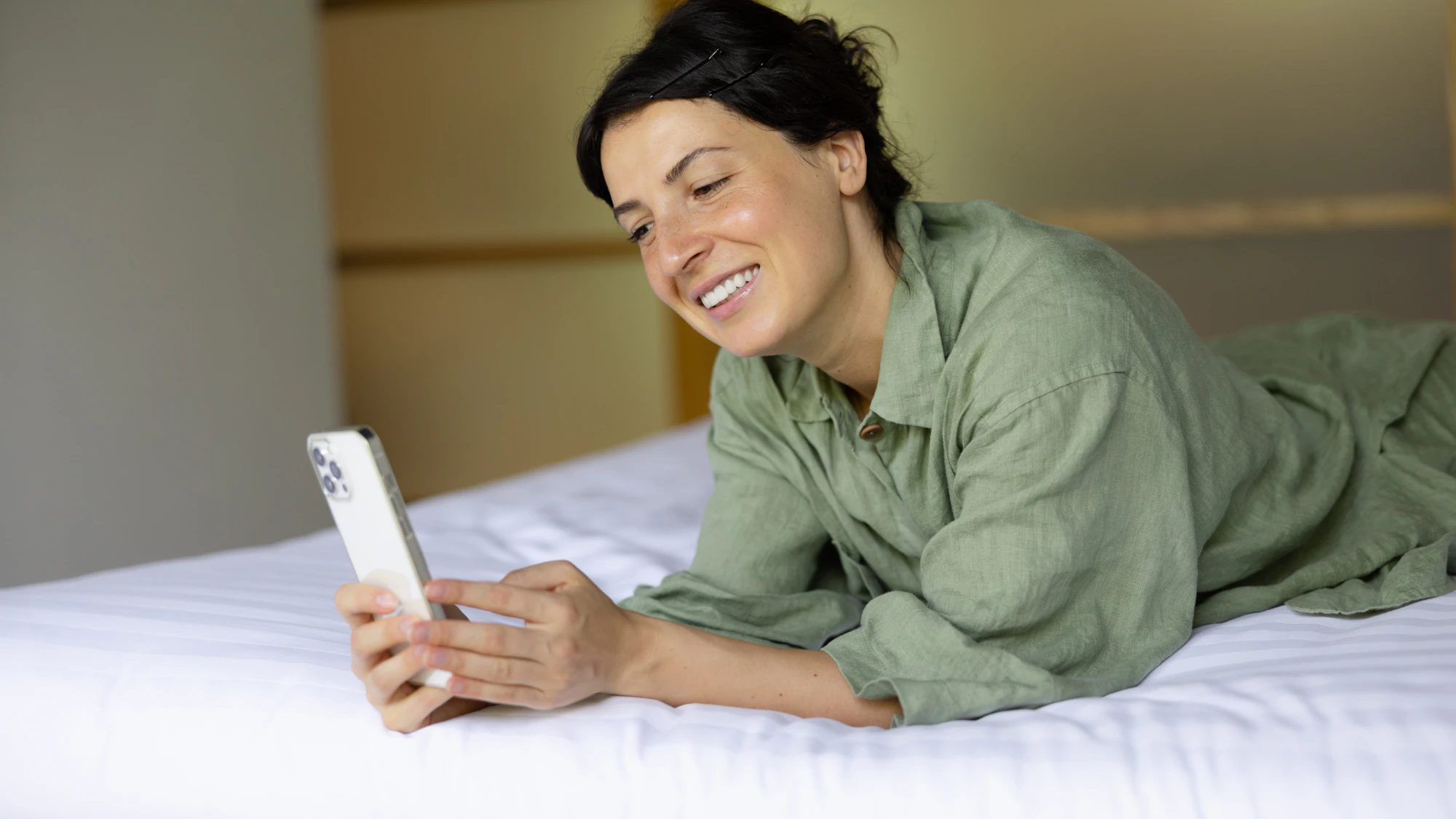 Guest booking a stay on her phone
