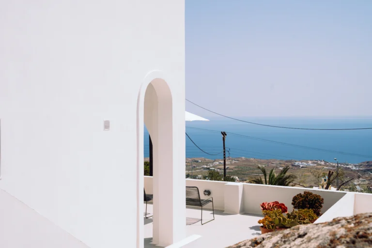 Sample hotel website photo: a white arch opening onto the sea